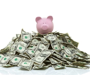 piggy-bank-on-a-pile-of-cash-picture-id491703341-1
