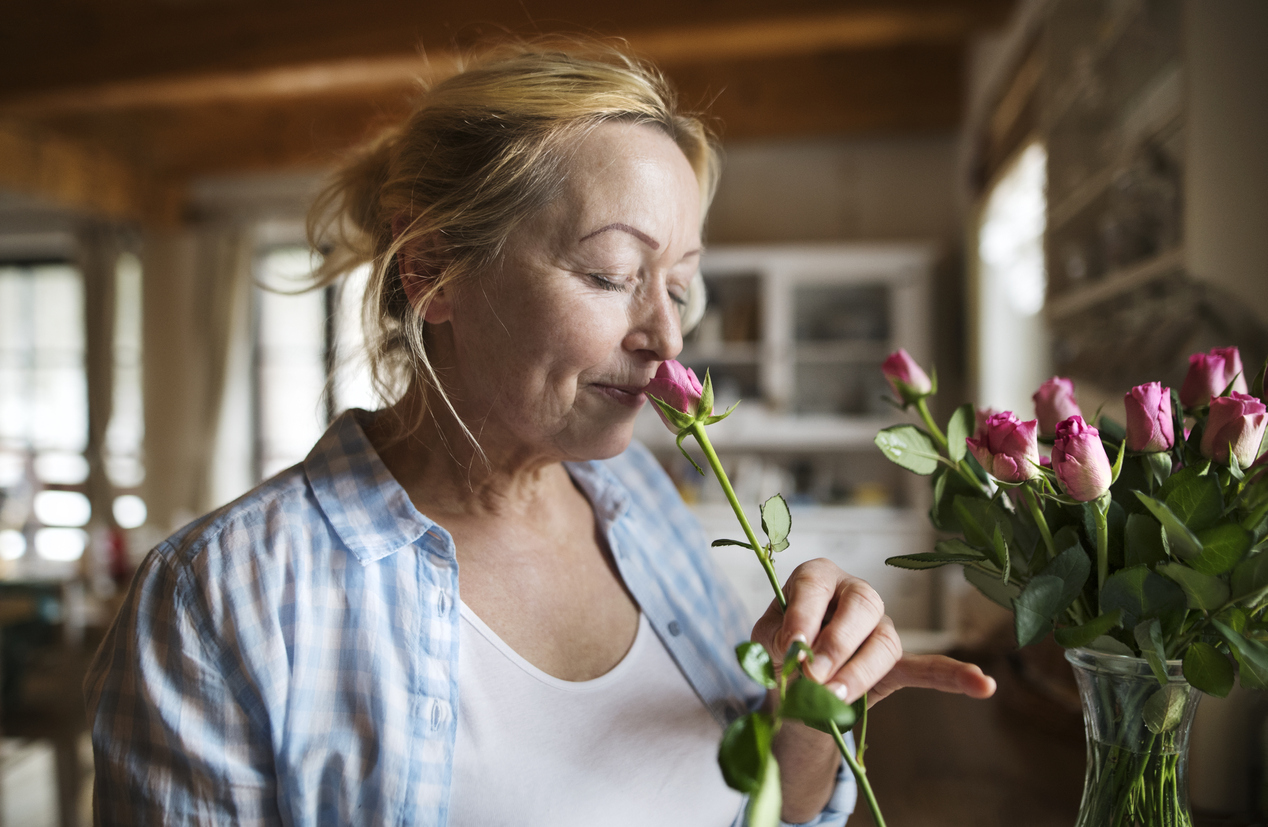 Woman Smelling Roses